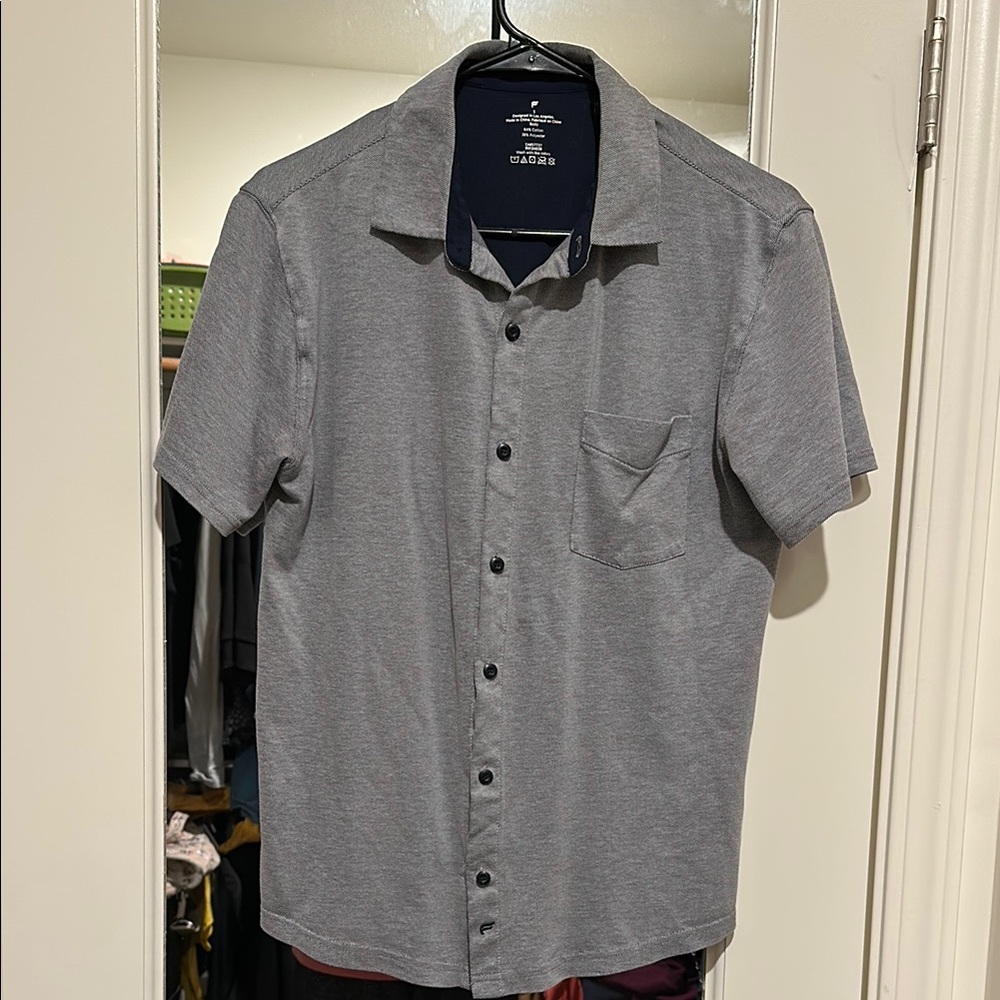 Fabletics blue short sleeved collared button up shirt. Light weight mate…